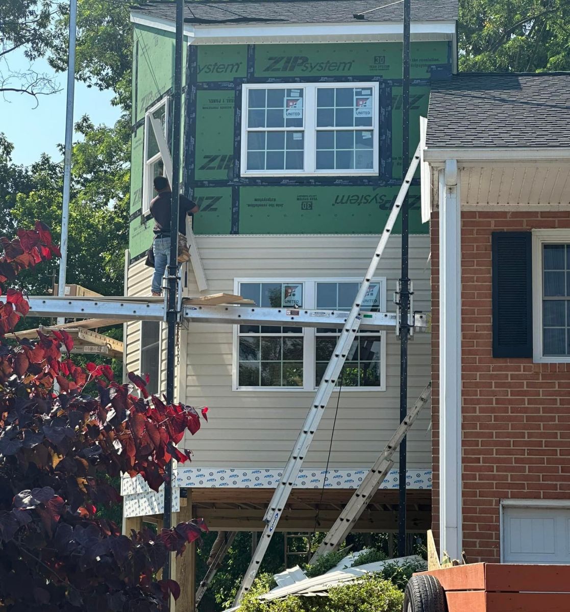 BluPoint Contracting installing new siding on a residential home